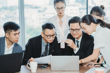 Business team leader presents to employees about upcoming work plans 