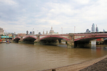 Fototapeta na wymiar St Pauls Cathedral across the river Thames