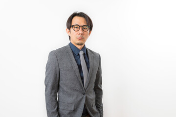 Successful Asian business man in suit and tie with confidence gesture on white background.