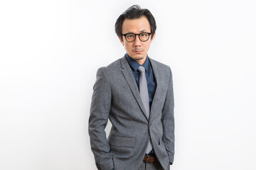 Successful Asian business man in suit and tie with confidence gesture on white background.