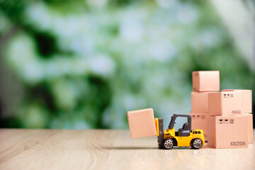 Concept of loading goods in packaging by forklift copy space - obrazy, fototapety, plakaty