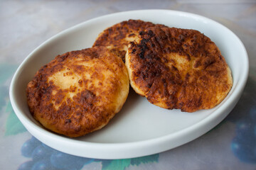 cottage cheese pastries, syrniki on a white background