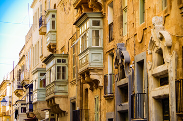 Romantic little side or backstreet alley inside historic old town of Valletta, Malta, UNESCO world heritage site in the Mediterranean, popular with cruise tourists for ancient facades