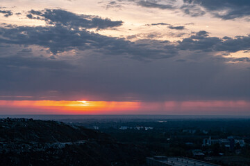 Construction waste in nature, field, ecological waste, dirt, critical ecological status. Dawn in...