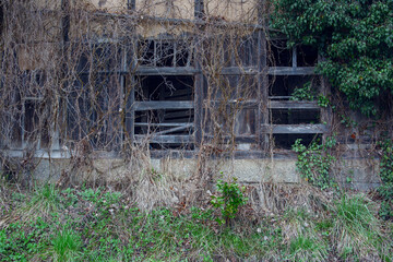Windows of an abandoned and derelict house in a small village in Japan