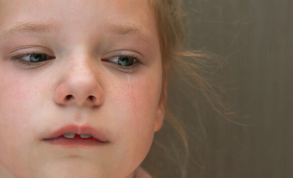 Crying kid girl close up