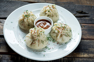 hinkali Georgian dish on white plate.