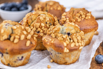 Some Blueberry Muffins (close-up shot; selective focus)