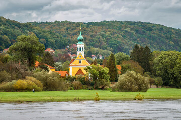 The old church on the Elbe in Dresden against the background of autumn trees. Dresden, Saxony,...