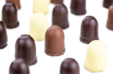 Obraz na płótnie Canvas Chocolate Marshmallows isolated on white (selective focus)