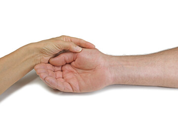 Giving a Palm Reading on White Background - female hand holding man's open hand isolated on a white...
