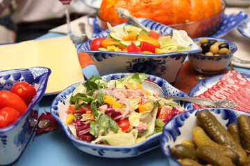 Festive treats on the table. Close-up of the table set at home during the holiday season. Blue tableware Gzhel