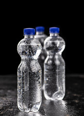 Bottles of sparkling water (chilled; close up shot)
