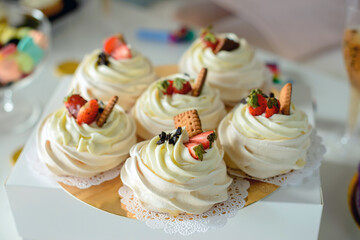 cupcake with whipped cream and strawberries