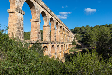Fototapeta premium Devil's Bridge (Pont del diable), Roman aqueduct built to supply water to the ancient city of Tarraco from the Francolí river. UNESCO's World Heritage Site since 2000. Tarragona, Catalonia, Spain