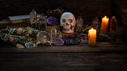 human skull, gemstones, candles on  on dark background. Crystals Stones Set. healing minerals for...