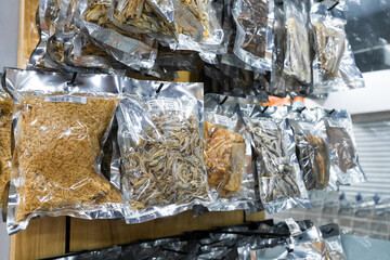 Showcase with dried fish at a grocery store