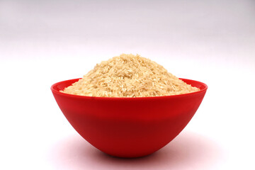 healthy raw white rice served in a red bowl 