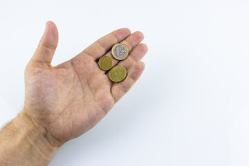 hand on a white background holding coins