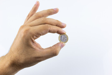 hand on a white background holding coins