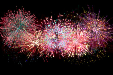 Realistic 3D illustration colorful rainbow firework pyrotechnic night dark sky smoke on isolated black background wallpaper use celebrate happy new year countdown festival anniversary birthday party