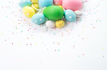 colorful Easter eggs lie on a light background