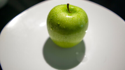 green apple on the plate