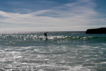 Fototapeta premium Man surfing on a beach