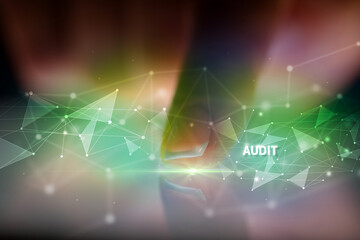 Finger touching tablet with AUDIT inscription, business concept