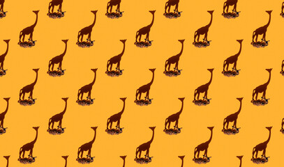Orange tropical seamless background with small wooden giraffe  figure and large shadows