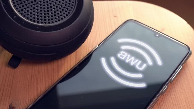 UWB or ultra wireband radio technology speaker connecting to a smartphone