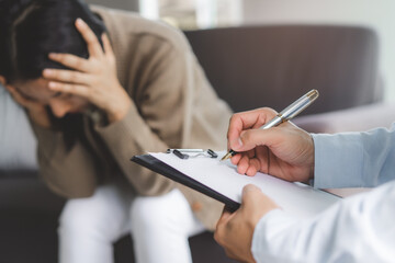 psychologist talking with depressed patient about mental condition.