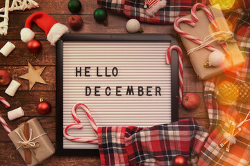 board with the words oh it December, Christmas decorations and candy canes. . High quality photo