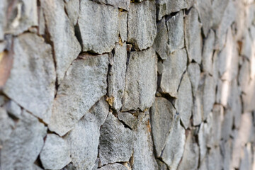 Background of stone wall of boulders and pebbles