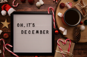 board with the words oh it December, Christmas decorations and candy canes. . High quality photo