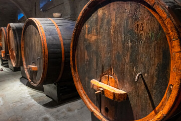 Ancient wine barrels in a cellar.