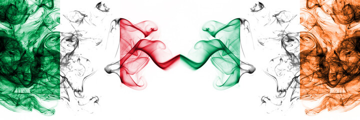 Italy vs Ireland, Irish smoky mystic flags placed side by side. Thick colored silky abstract smoke flags