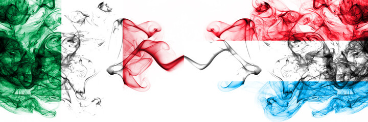 Italy vs Luxembourg smoky mystic flags placed side by side. Thick colored silky abstract smoke flags