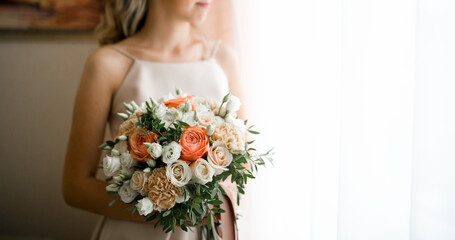 bouquet in the hands of the bride