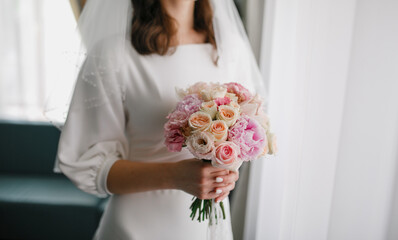 bouquet in the hands of the bride