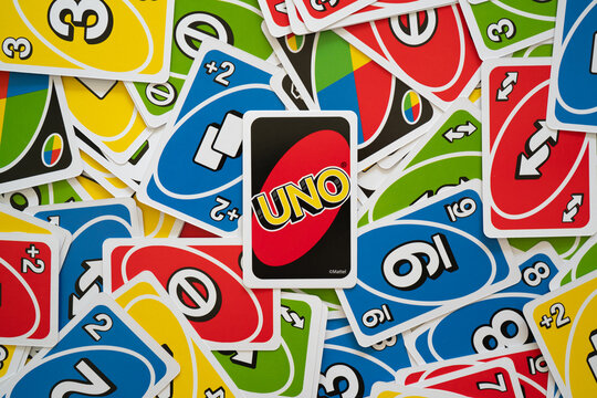 Deck of Uno Game Cards Scattered All Over on a Table. American