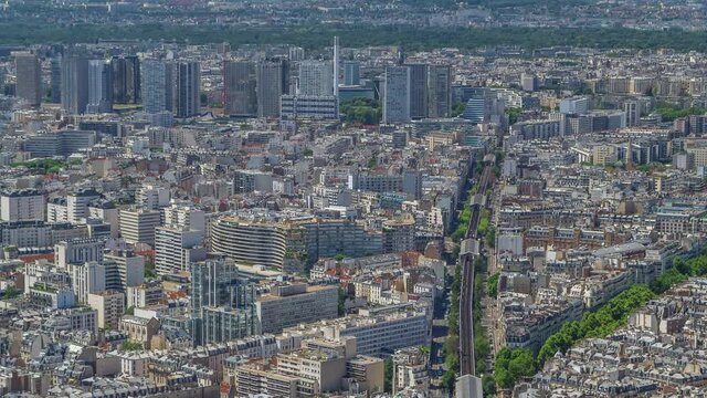 Top view of Paris skyline from above timelapse. Main landmarks of european megapolis with Boulevard de Grenelle and metro line. Bird-eye view from observation deck of Montparnasse tower. Paris, France