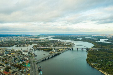 Fototapeta na wymiar Aerial view of the Dnipro River and districts of Kyiv - the largest city and capital of Ukraine.