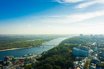 Fototapeta premium Aerial view of the Dnipro River and districts of Kyiv - the largest city and capital of Ukraine.