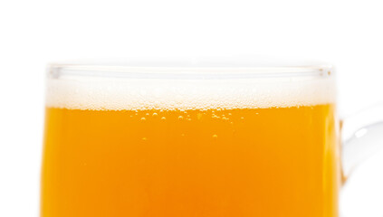 Mug of foamy beer isolated on white background.