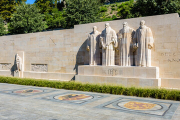 The four statues at the center of the Reformation Wall in the Parc des Bastions in Geneva,...