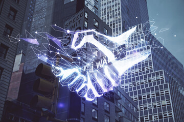 Double exposure of handshake hologram over city view background. Concept of partnership.