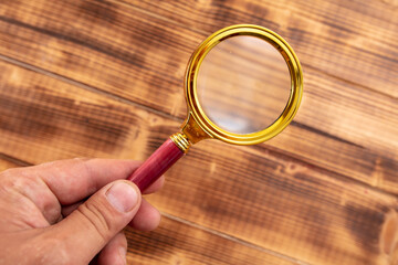 Close-up of a magnifier in hand