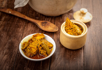 Homemade raw mango pickle, mango pickle is a traditional Indian condiment made with raw mangoes, spices and oil.