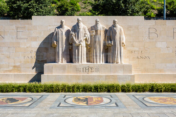 Front view of the four statues at the center of the Reformation Wall in the Parc des Bastions in...